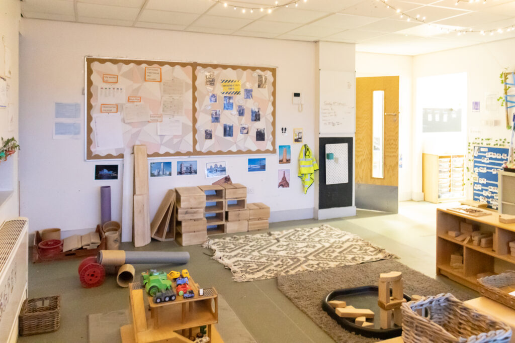 The three to five years section of the nursery. There are age-appropriate toys and activities, and fairy lights across the ceiling.